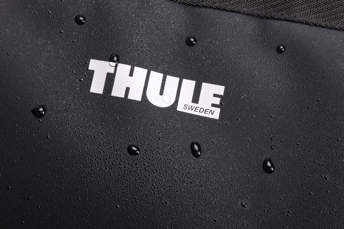 Thule Chasm 55L Gear Hauler, Waterproof Base, Internal Pockets and Movable Divider Panels, Zippered lid, Sturdy Grab Handles